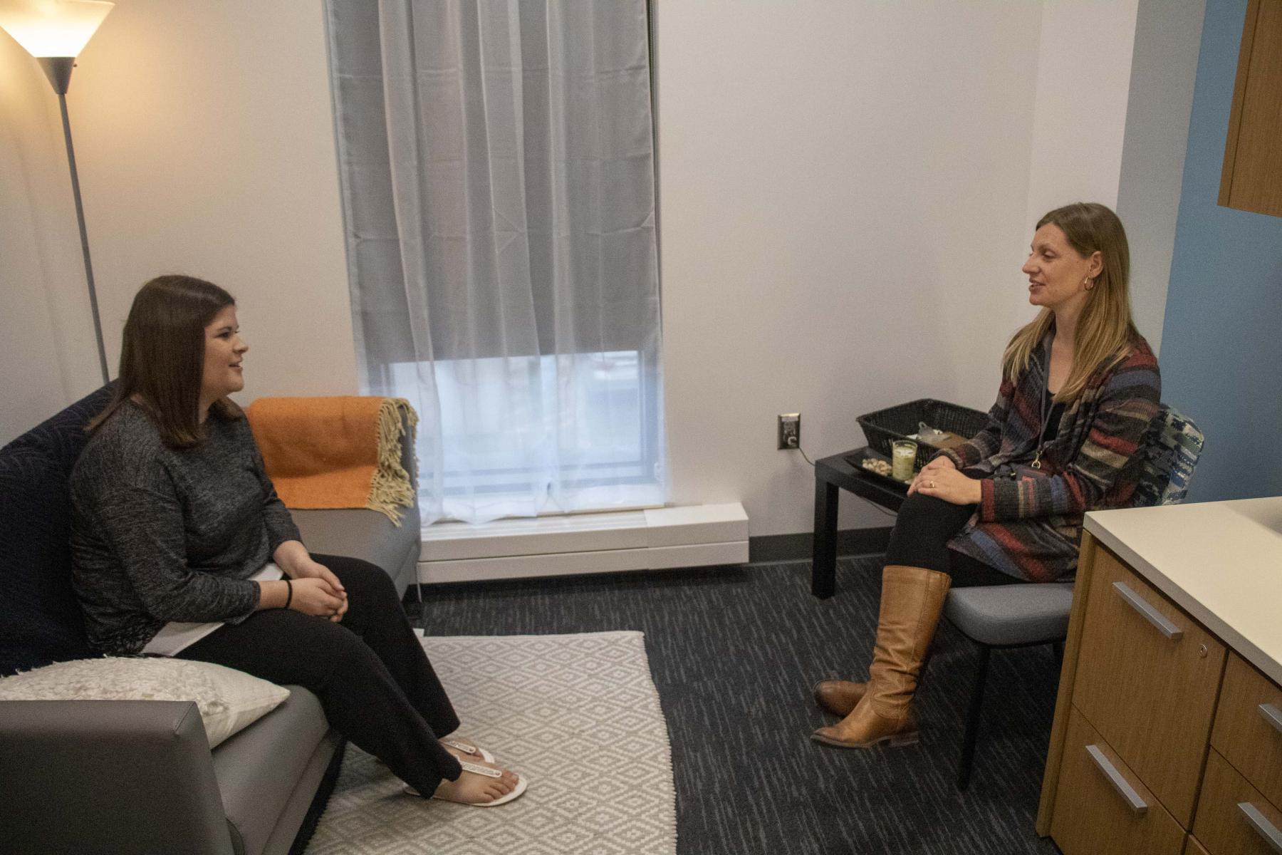 A counselor and student in a private session