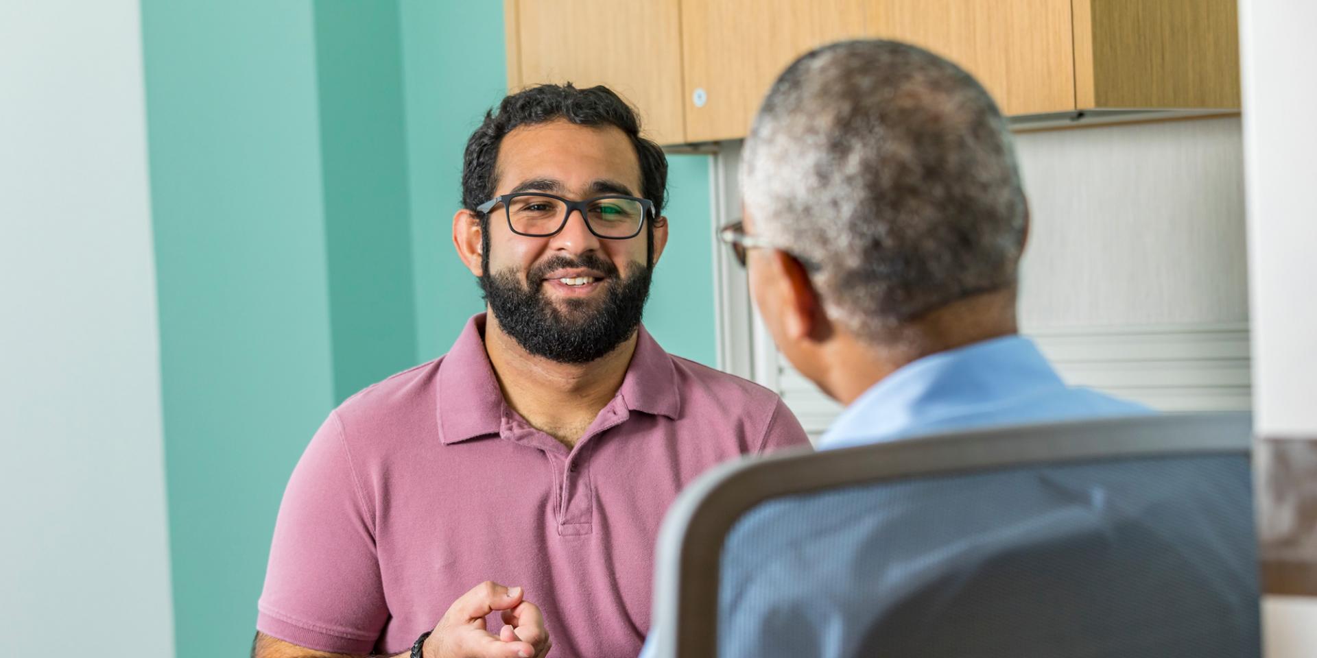 A counselor and patient talk at therapy